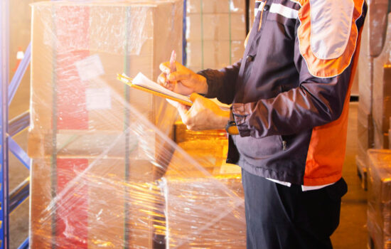 warehouse-worker-doing-inventory-management-storage-warehouse-supply-chain-package-boxes-2